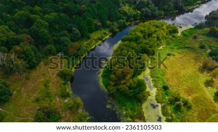 aerial landscape summer country side scenery photography top view from drone with woods field and river stream