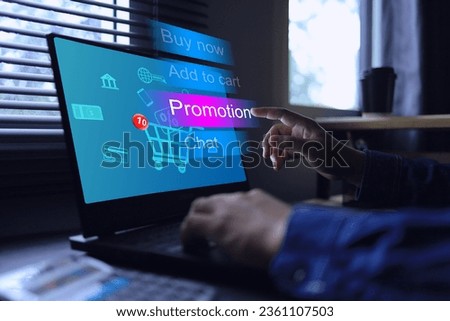 Customer is visiting online sale website on computer screen and clicking on promotions in online stores to see what promotion discount or sale are being offered this month. Digital marketing concept. Royalty-Free Stock Photo #2361107503
