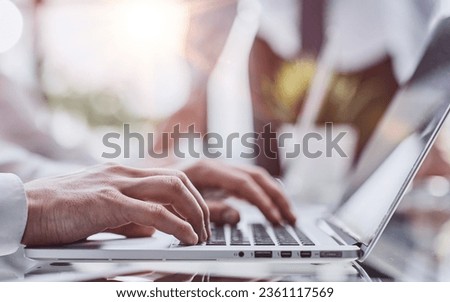 Business man sitting at table surfing the internet, online working at office, telecommuting concept
