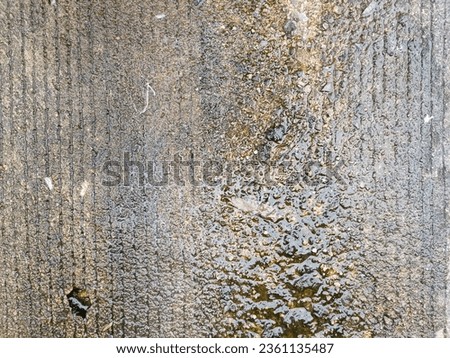 Stained and Discolored Concrete Floor with Watermarks and Stains
