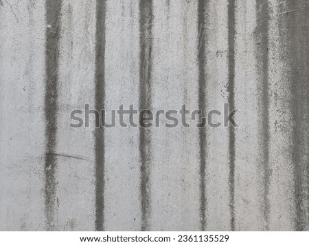 Stained and Discolored Concrete Floor with Watermarks and Stains