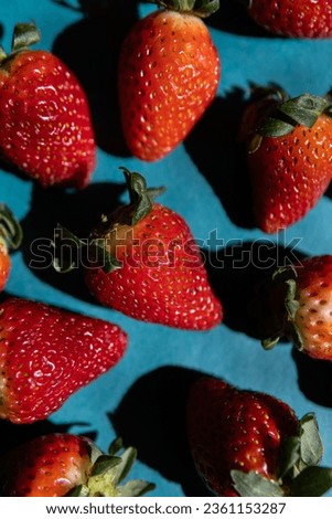 Fresh strawberry in green background