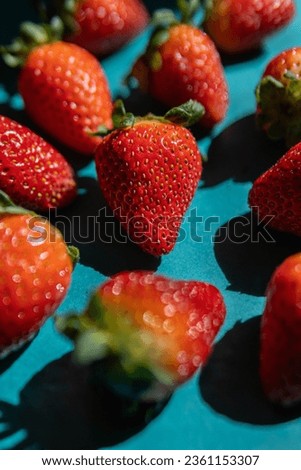 Fresh strawberry in green background