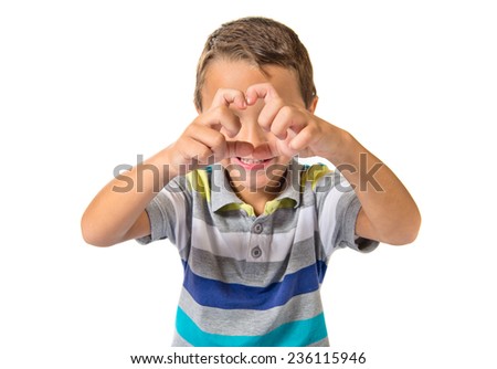Child making a heart with her hands