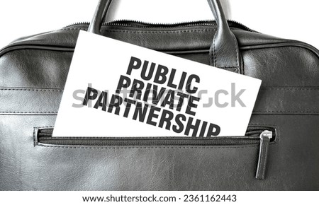 Text PUBLIC PRIVATE PARTNERSHIP writing on white paper sheet in the black business bag. Business concept