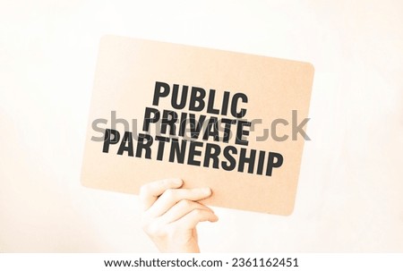Closeup Business man hand holding show blank paper sheet mock up . Text PUBLIC PRIVATE PARTNERSHIP