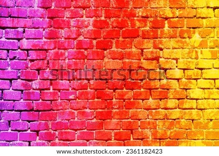 Red wall texture made from brick pattern in rainbow color hue abstract wallpaper in psychedelic background