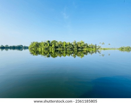 The rivers contribute to the state’s lush greenery, provide water for agriculture, and offer opportunities for tourism, including activities like houseboat cruises in the Kerala Backwaters. Royalty-Free Stock Photo #2361185805
