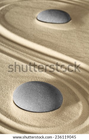 spa wellness background zen stone and sand garden raked lines lead to balance and purity. Massage stones therapy.
