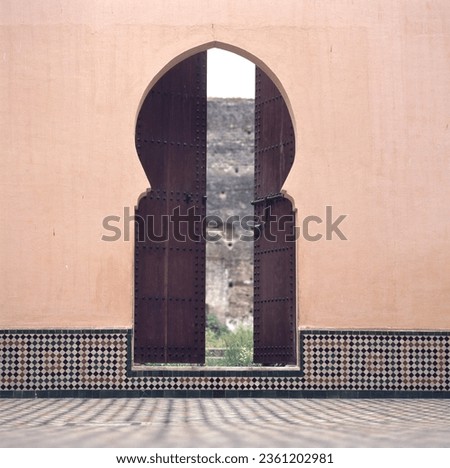 Traditional Moroccan door inside the Mausoleum of Moulay Ismail.This Mausoleum  is a historic Islamic funerary complex in Meknes, Morocco Royalty-Free Stock Photo #2361202981