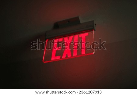 exit sign glows brightly, symbolizing safety and guidance in emergency situations in urban environments