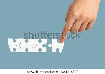 Hand connecting, adding puzzle piece, final touch concept