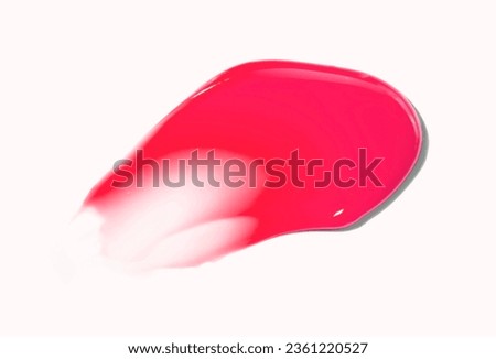 Cosmetic balm lip tint smudge fuchsia red cherry color on beige Royalty-Free Stock Photo #2361220527