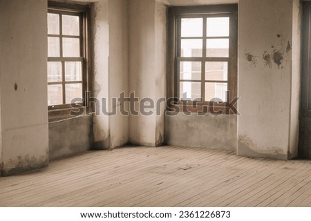 Very old abandoned factory warehouse with wooden floors and windows and clay tiles.