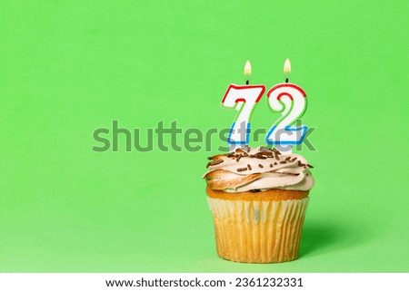 Birthday Card With Cupcake And Number 72 Candle; Photo On Green Background.