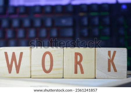 Photo of wooden blocks that make up the vocabulary "WORK" in English