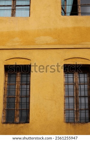 Old retro doors and windows damaged from weather in ancient city of Gjirokaster in Albania exploring Balkan travel high quality big size instant stock photography prints