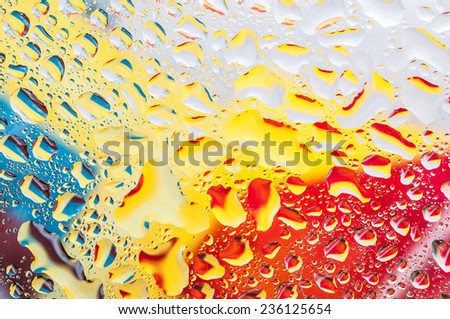 Macro image of water on colorful background