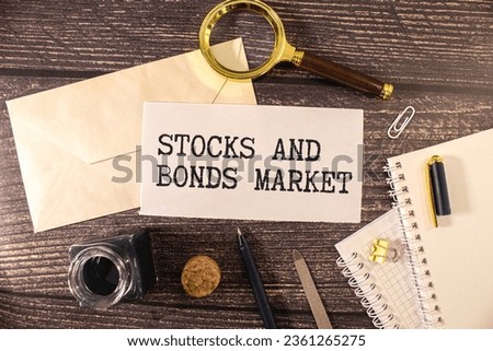 Wooden blocks with the text CORPORATE BONDS lie on a light background on a white calculator. Nearby is a black handle. Business concept