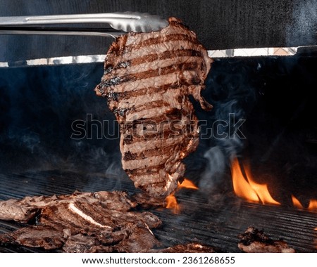 mexican style carne asada, charcoal grill for grilling arrachera and sirloin style meat, carne asada from northern mexico, carne asada tacos from sonora, traditional mexican food.