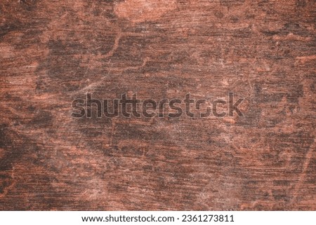 Brown wood texture background from natural tree. The wood panel has a beautiful dark pattern. selective focus
