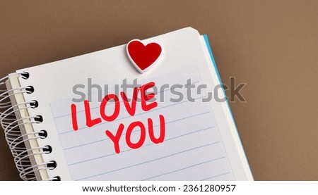 I love you on notebook paper. Love word on the sticker. Love, Valentine's Day, Romantic, Wedding or Birthday background. Feel the Love.