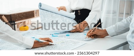 Worker, architect and engineer work on real estate construction project oratory planning with cartography and cadastral map of urban town area to guide to construction developer business plan of city Royalty-Free Stock Photo #2361304297