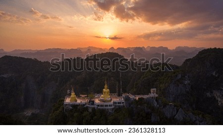 
Aerial view Tiger Cave Temple is a Buddhist temple in Krabi, Thailand. 
It is known for the tiger paw prints in the cave, 
tall Buddha statues and the strenuous flight of stairs to reach the summit. Royalty-Free Stock Photo #2361328113