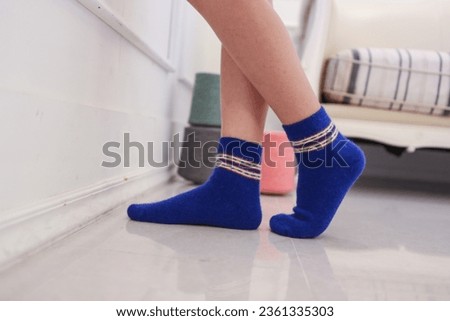 Photo of wearing winter wool socks and a warm atmosphere