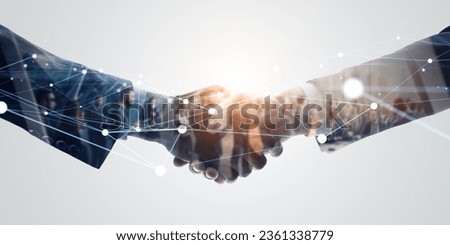 Group of multinational people  shaking hands and communication network concept. Wide angle visual for banners or advertisements.