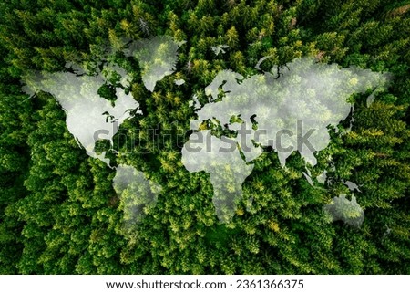 Global map against a woodland with cloudy sky - global village and environmental conservation concept.