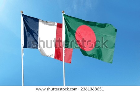 French and Bangladeshi flags flutter under cloudy skies. flying in the sky