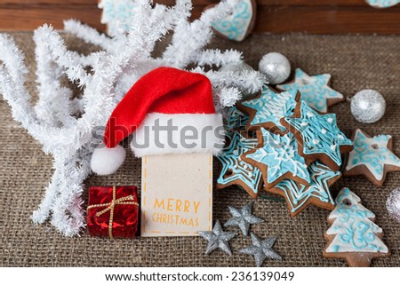Christmas colorful gingerbread and Christmas decoration on a linen background