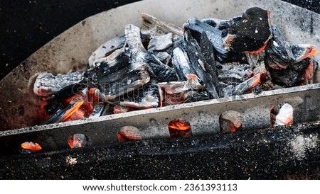 Smoke from starting a fire, Make a fire with charcoal, light up the coals. prepare a grill         