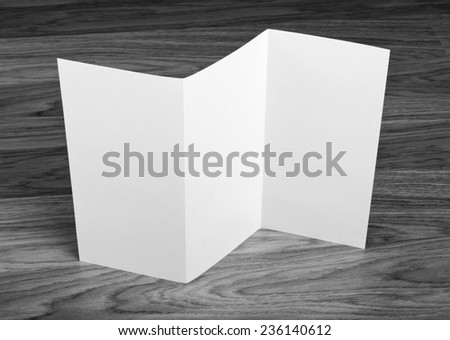 Blank folding page booklet on wooden background