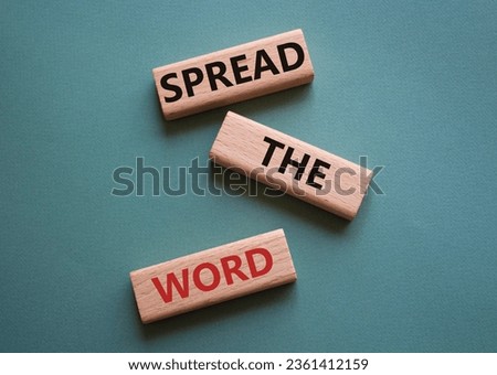 Spread the Word symbol. Concept wordsSpread the Word on wooden blocks. Beautiful grey green background. Business and Spread the Word concept. Copy space.