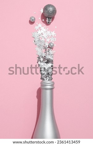 The concept of celebrating the New Year 2024, a bottle with glitter