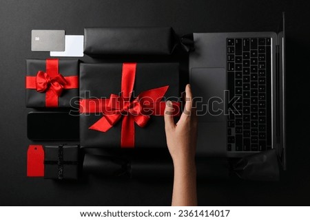 Black friday concept, with laptop and packages on table.