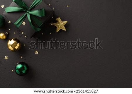 Embrace the New Year with luxury and elegance, as top-view shots capture black giftbox adorned with green ribbon bow, gold and green baubles, star ornament, confetti, set against chic black backdrop