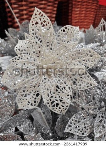 silver close-up decoration in the form of a Christmas poinsettia flower. High quality photo