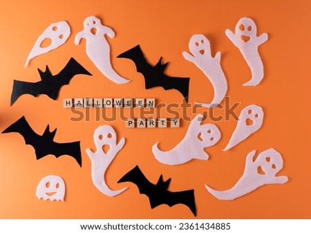 White ghosts and bat craft for Halloween party. Paper ghost on orange background top view. Cartoon creepy Whisper. Set boo characters. Word wooden letter phrase.