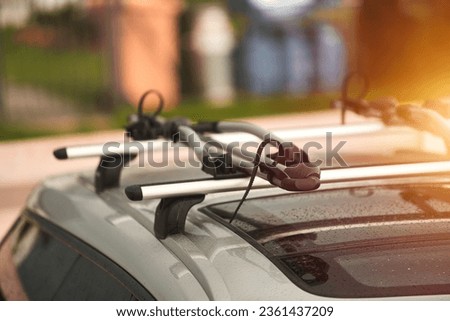 Versatile Roof Rack for Station Wagons: Safely Transporting Sports Equipment and Big Items. A roof rack or bar on a station wagon or estate car. Transportation of sports equipment in the family car. Royalty-Free Stock Photo #2361437209