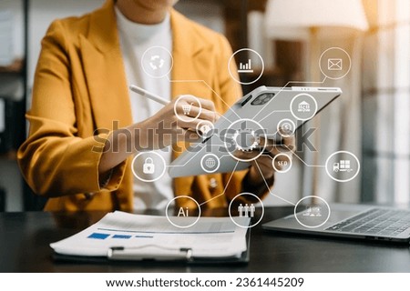 Digital marketing media in virtual screen.business woman hand working with mobile phone and modern compute with VR icon diagram at office in morning light