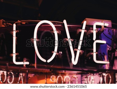 Neon sign light Love word type Holiday background