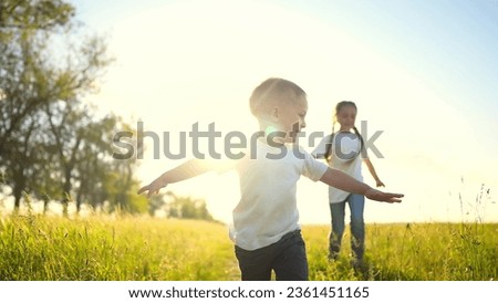 happy family kids. people in park children child running together in the park at sunset silhouette. mom dad daughter and son are run happy family and little child in fun summer. dream kids run