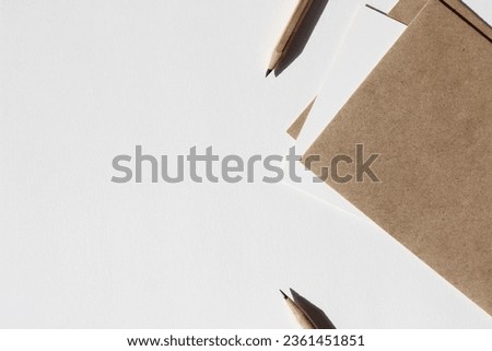 Kraft Envelopes and Cards, Graphite Pencils on Copy Space Office Desk Background. Business Workplace Template.
