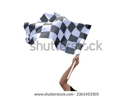Checkered race flag in hand against white background Royalty-Free Stock Photo #2361453303