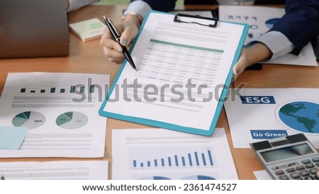 Carbon offset price report CO2 emission. Future growth Net zero waste in ESG ethical SME office protect climate change global warming social issues project. Group of asia people Eco friendly SDGs plan Royalty-Free Stock Photo #2361474527