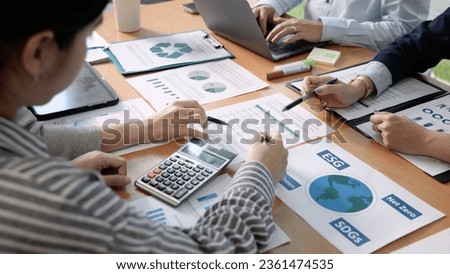 Carbon offset price report CO2 emission. Future growth Net zero waste in ESG ethical SME office protect climate change global warming social issues project. Group of asia people Eco friendly SDGs plan Royalty-Free Stock Photo #2361474535