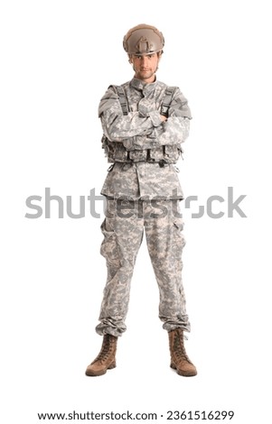 Young male soldier in full gear isolated on white background